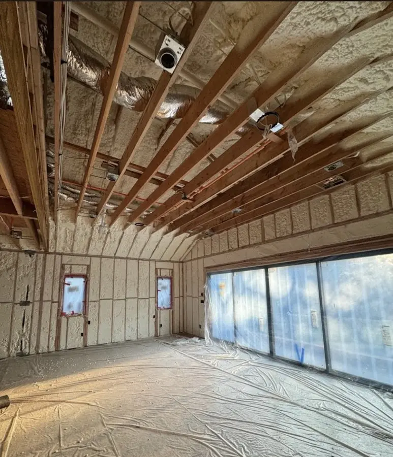 Interior walls and ceiling insulated with spray foam during new construction in Auburn